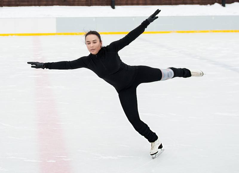 Figure skater training on practice ice