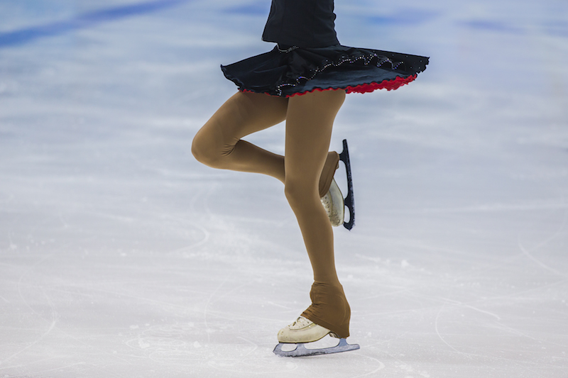 Figure skater in ice arena
